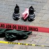 Clothing is strewn on the sidewalk at a scene where pedestrians were hit by a motorist in Portland, Ore., Friday, May 25, 2018. Police say three women have been injured in a hit-and-run crash near Portland State University.